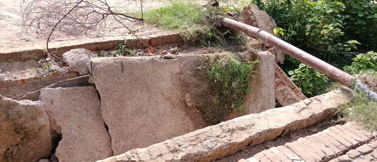 Culvert over minor canal collapses; passage becomes difficult.