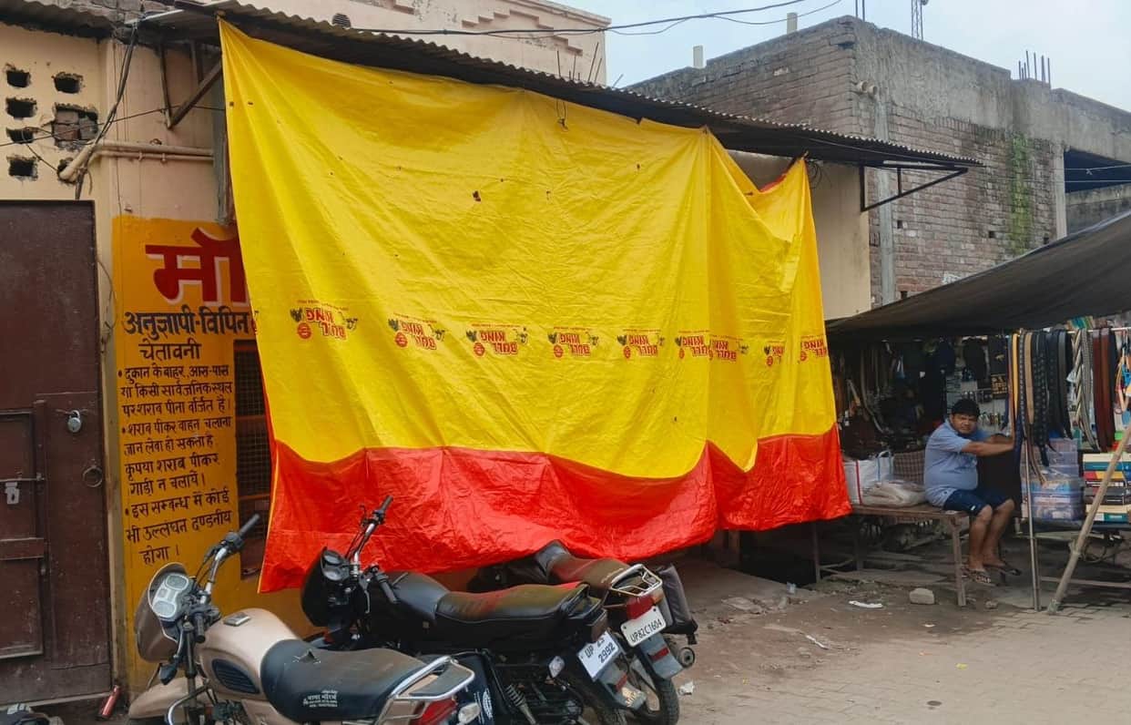Liquor shops on the Kanwar route are sheltered by tarpaulins.