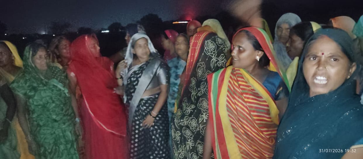 Women protest against the opening of a liquor shop in the village.