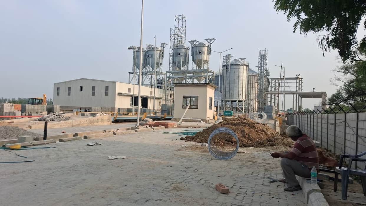A modern warehouse for grain storage is being constructed