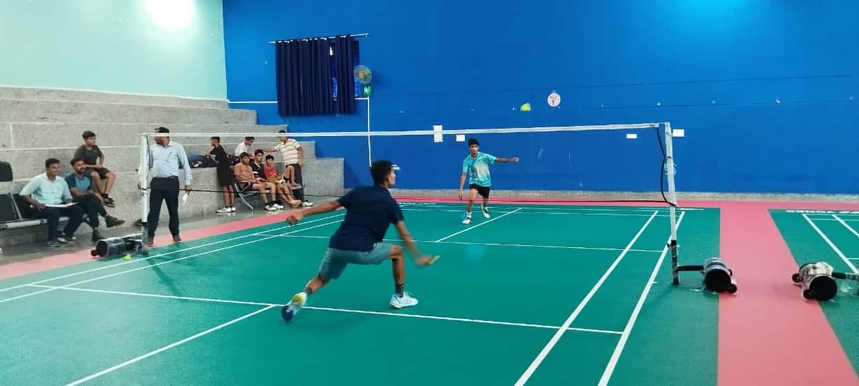 Players showcase their skills in badminton tournament; selected for divisional level.