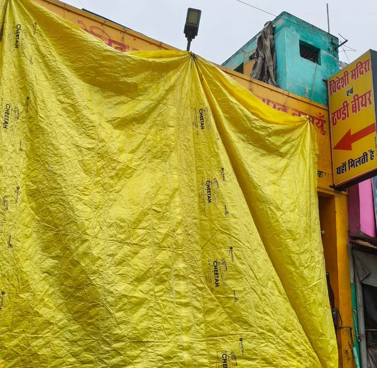 Liquor shops covered with tarpaulins; meat shops also closed.