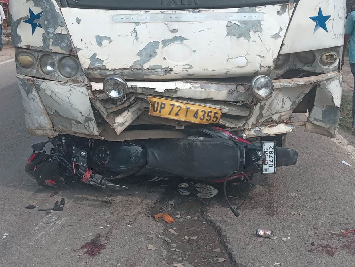 Bike hit by bus; couple and young child injured.