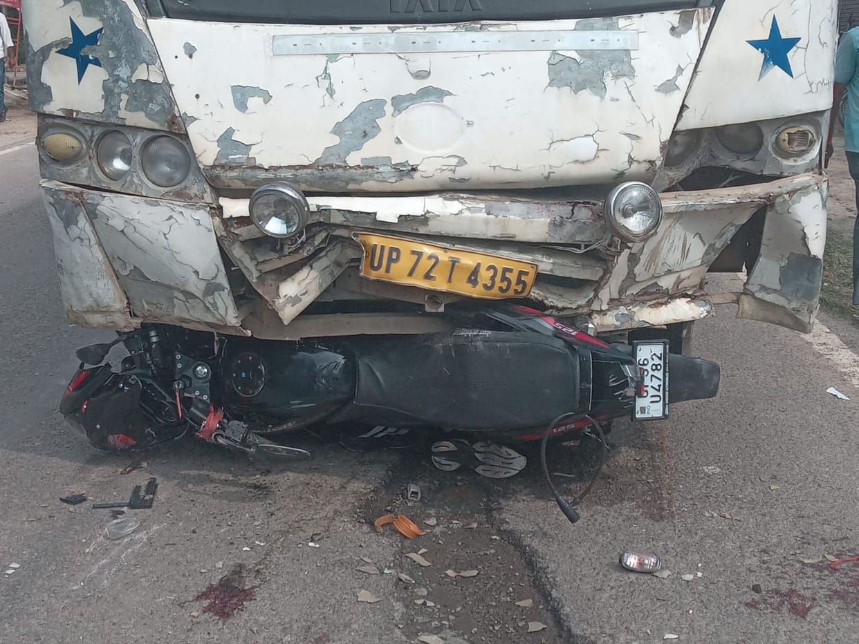 Bike hit by bus; couple and young child injured.