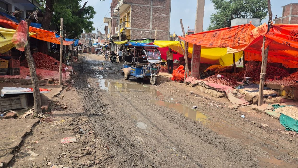 Patients endure jolts while traveling to the CHC on the dilapidated road.