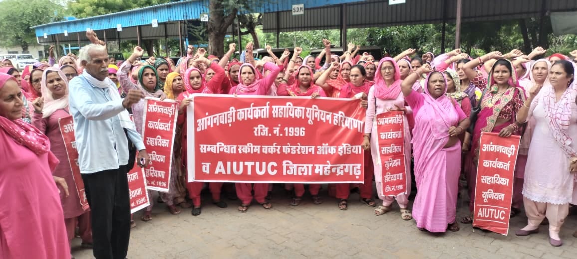 Anganwadi workers protest, demand payment for 975 personnel.