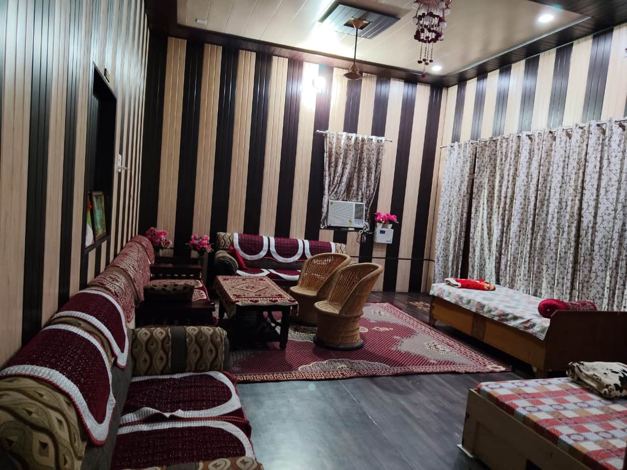 Rooms ready for homestay; host awaits tourists.