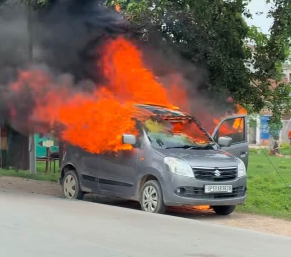 Car engulfed in flames near Collectorate turn; occupants jumped out to save their lives.