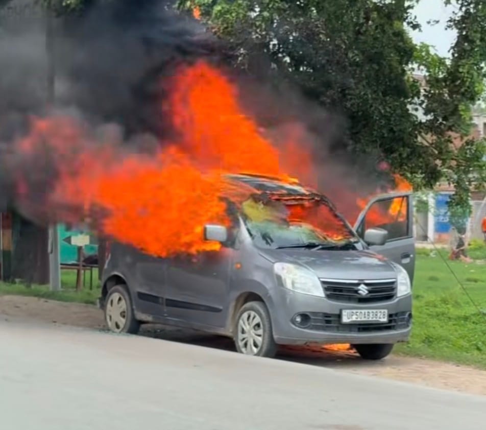 Car engulfed in flames near Collectorate turn; occupants jumped out to save their lives.