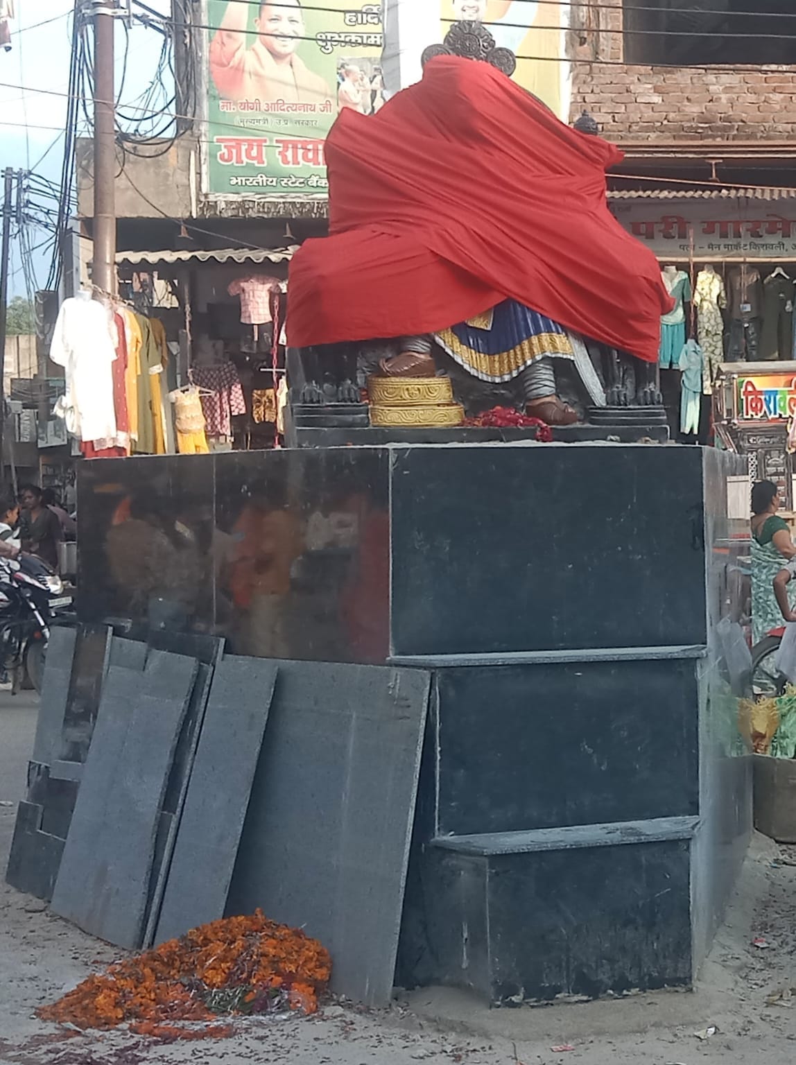The statue of Maharaja Surajmal is covered with a cloth.
