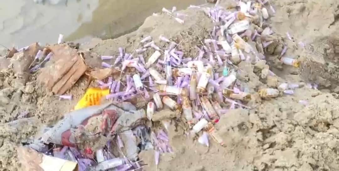 Biomedical waste found buried in the sand along the banks of the Dhela River.