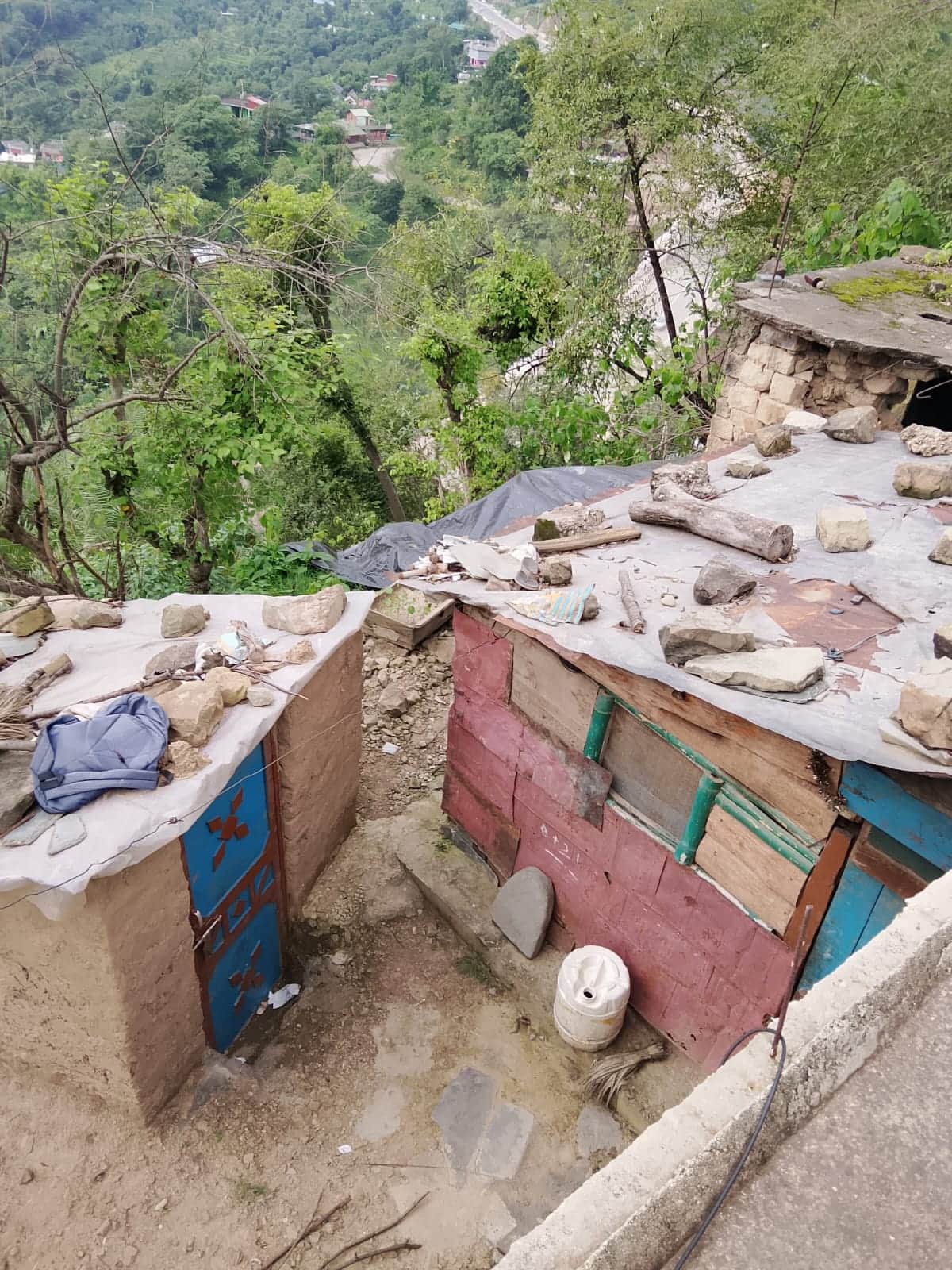 House at risk due to landslide at Black Nala; family shifted to a safe location.