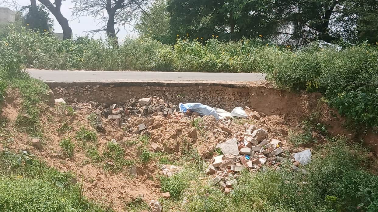 Soil slips from beneath the road on the Behal-Patwan route; risk of subsidence.