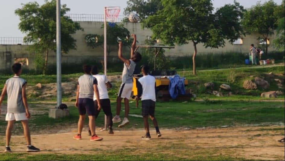 Players learn passing and shooting skills at the netball camp