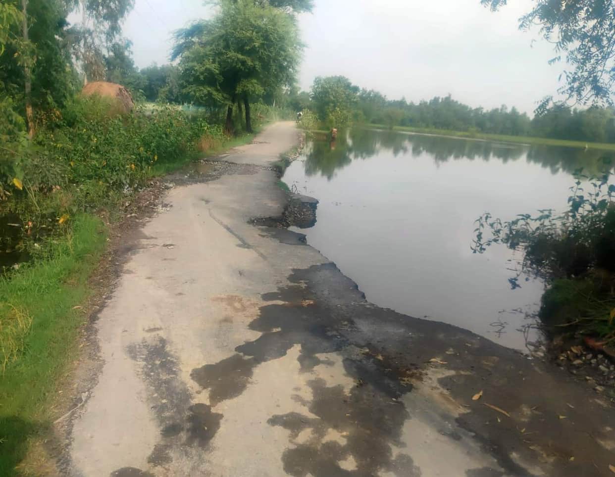 Ambulance stuck on a washed-out road at the Makarandpur pond.