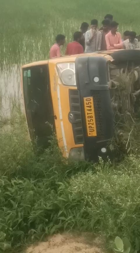 An uninsured school van filled with children overturned into a roadside field.