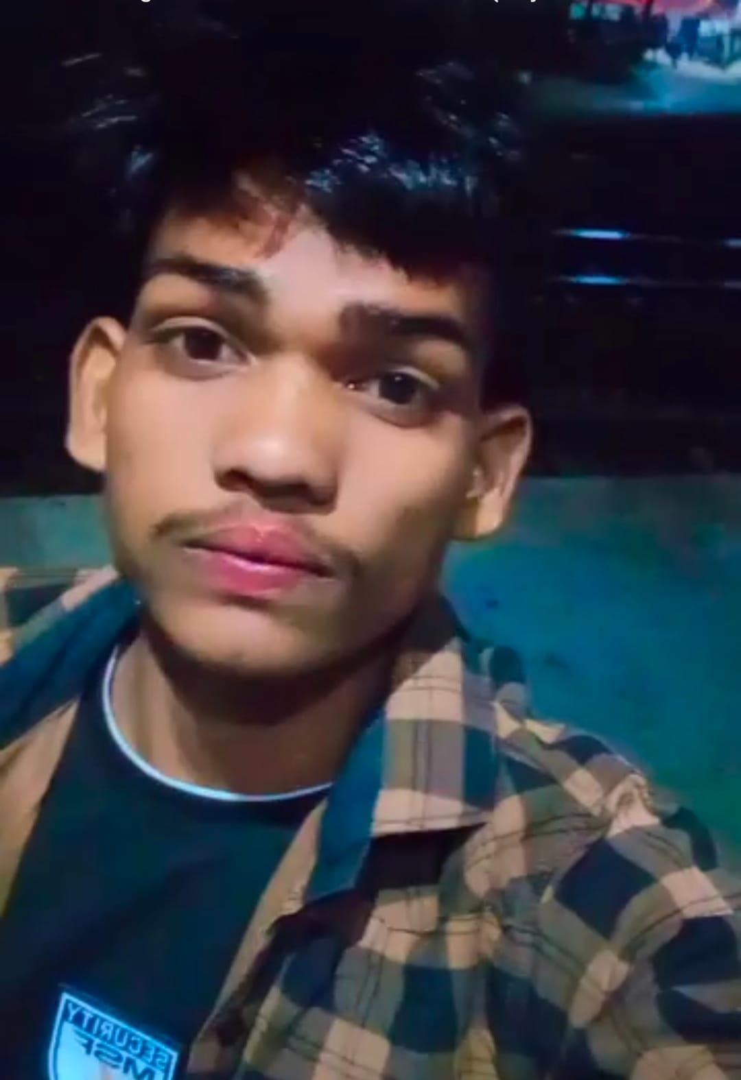 Youth's body found hanging from tree; murder alleged.
