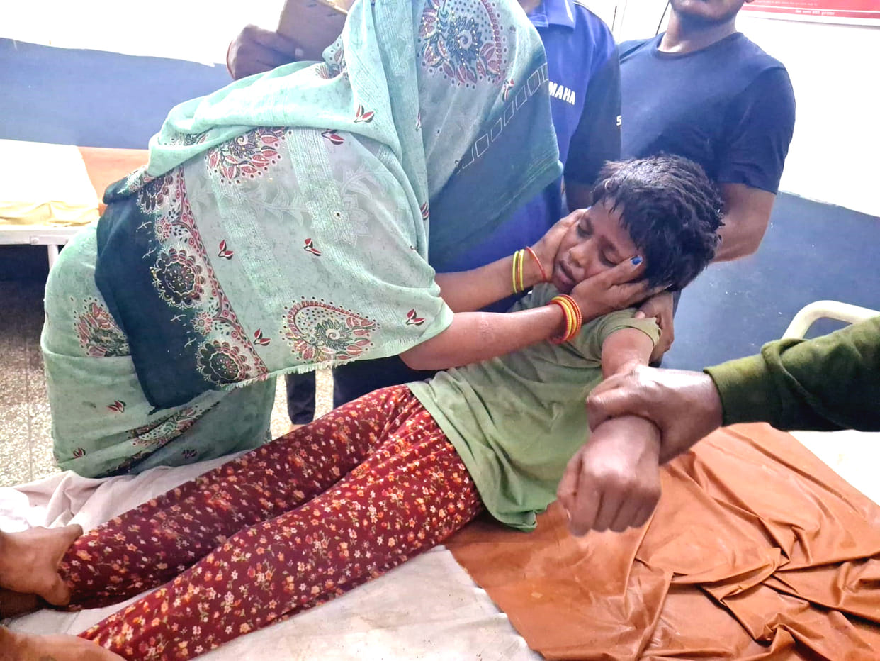 High-tension wire falls on two young siblings walking home; both critically injured.