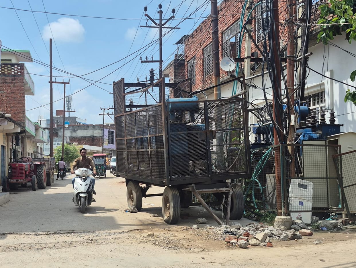 Current surging through exposed transformers; department officials fast asleep.