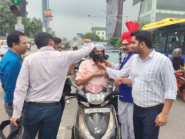 Raised awareness about safe traffic practices and distributed helmets.
