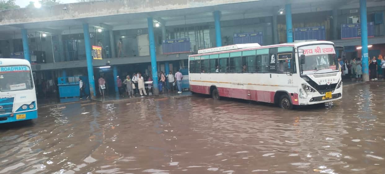 Rewari bus stand turns into a pond with 30 mm of rainfall.