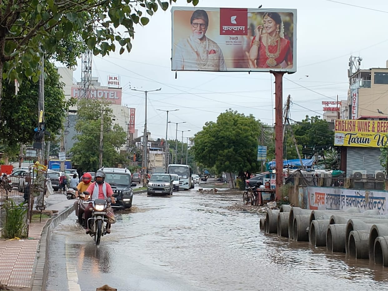 Temperature drops due to rain; waterlogging causes inconvenience to people.