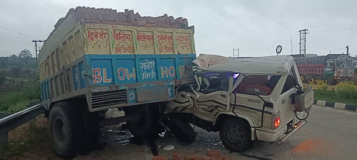 Bolero collides with brick-laden tractor-trolley; driver injured.