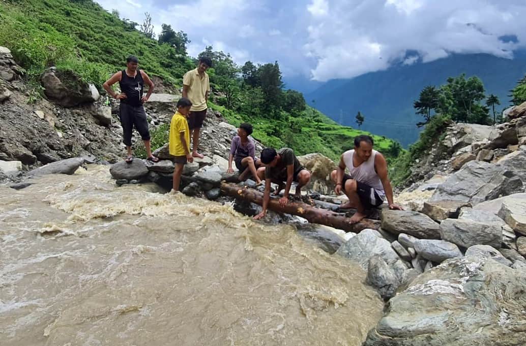 Road washed away, gas cylinders exhausted, local stream in spate; children unable to go to school for four days.