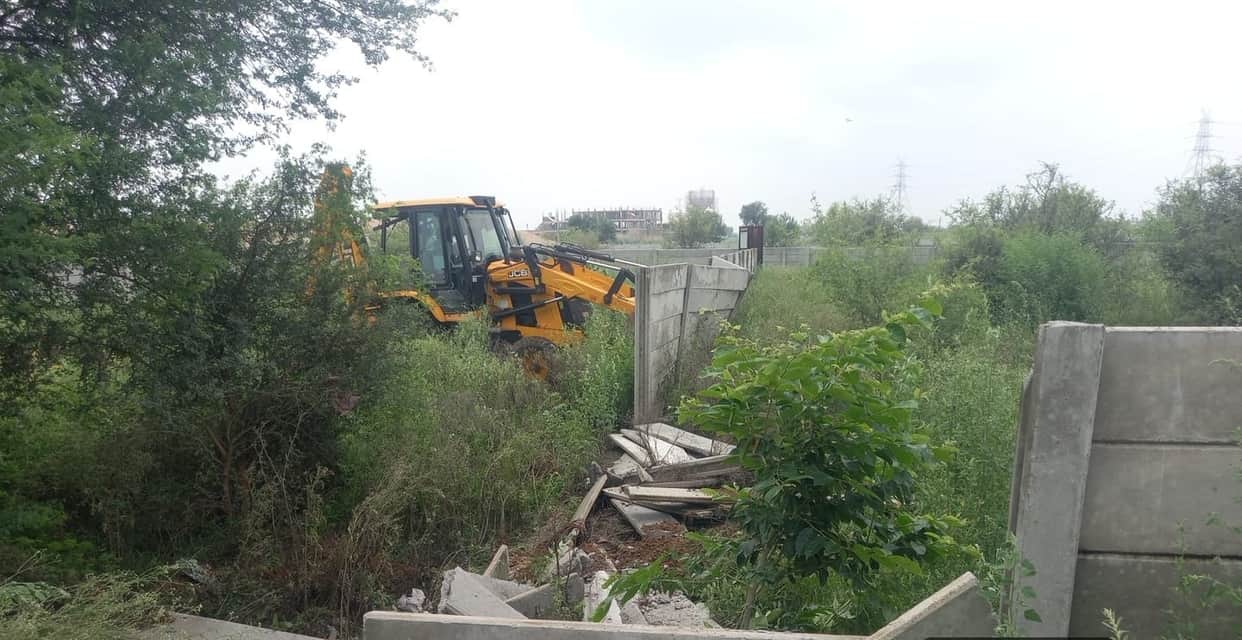Bulldozer razes illegal colony; 12 DPC structures demolished.