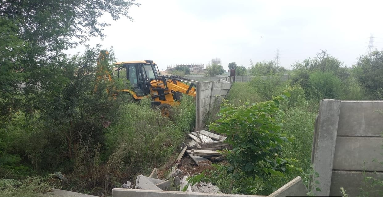 Bulldozer razes illegal colony; 12 DPC structures demolished.