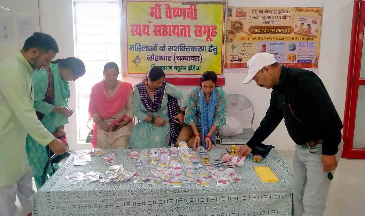 Self-help group women set up a Rakhi stall at the post office.