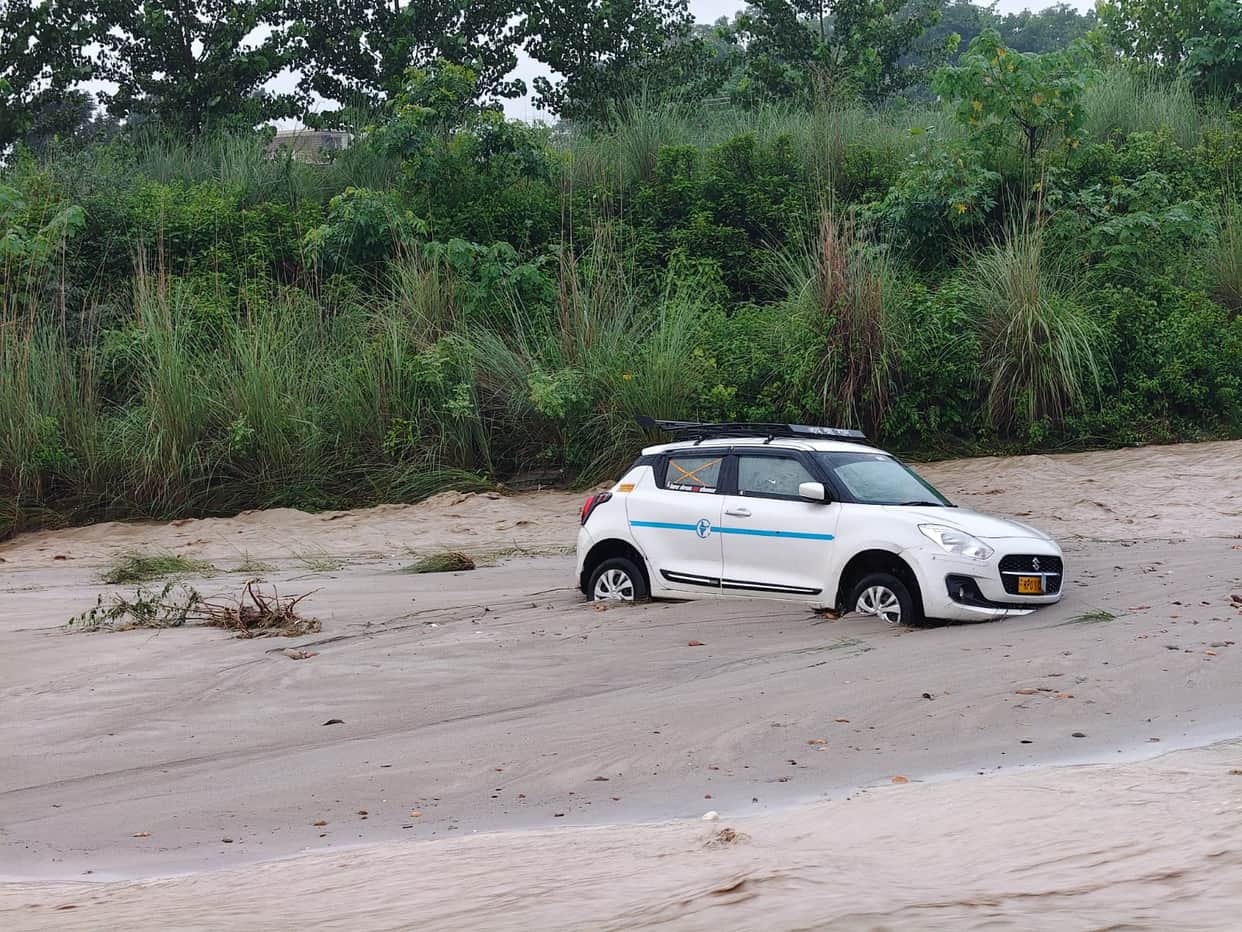 Car swept away by strong currents of Pandoga Khad; two youths narrowly escape.