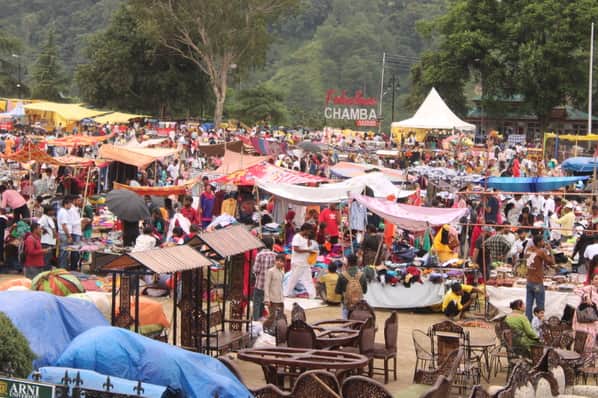Pop-up market set up at Chaugan; people are shopping.