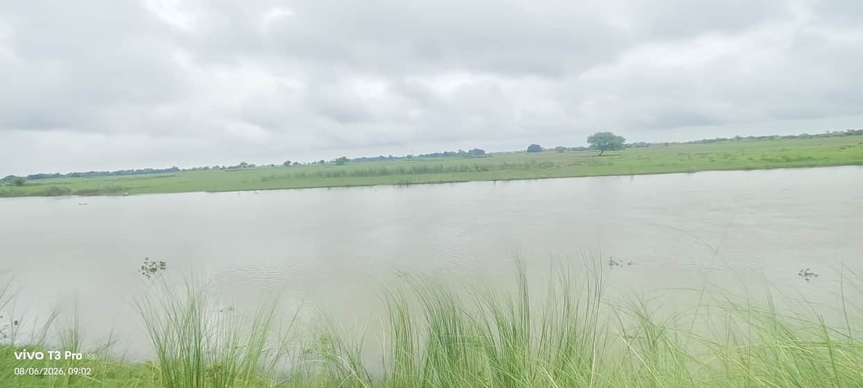 Floodwaters headed towards villages and crops.