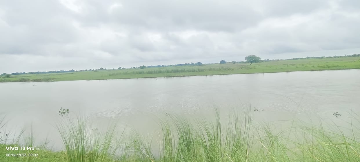Floodwaters headed towards villages and crops.