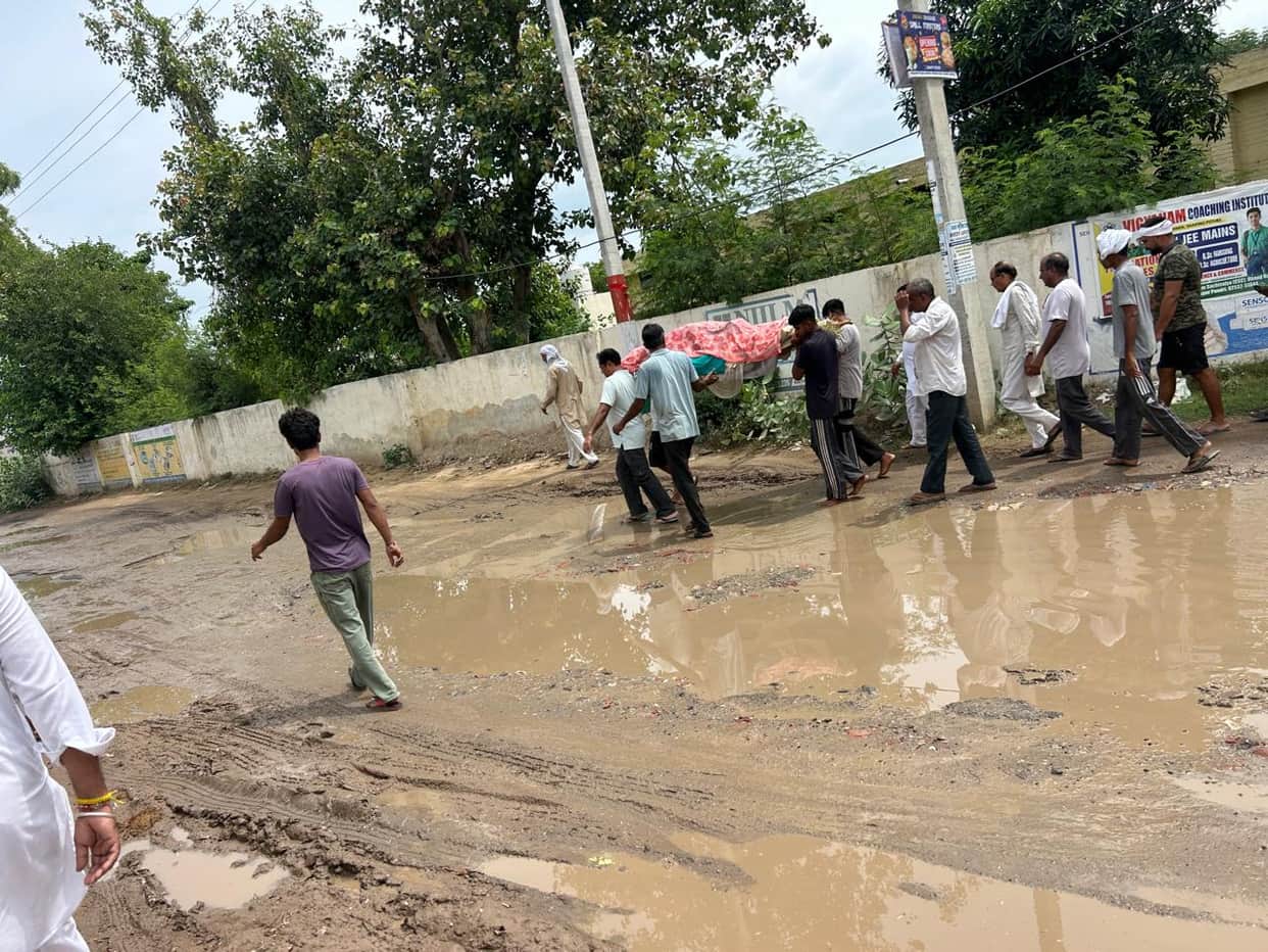 The main road to Phalgu Tirth has been in a dilapidated state for 10 years, with large potholes and waterlogging at various points.