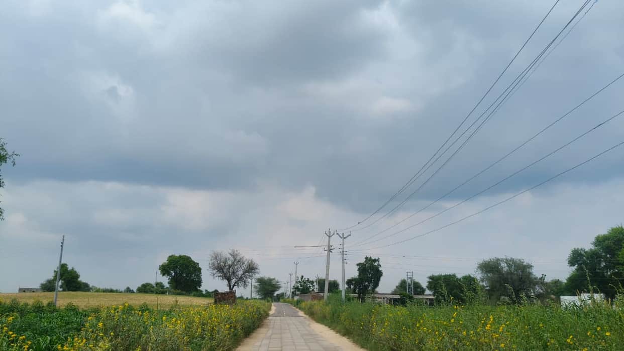 Humid heat caused distress; weather turned pleasant following afternoon drizzle