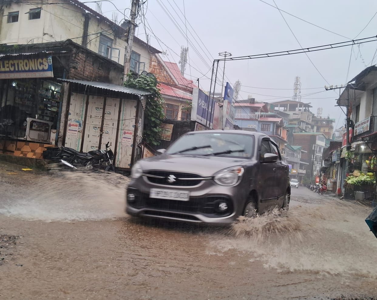 Torrential midnight rain terrifies residents; water enters shops.