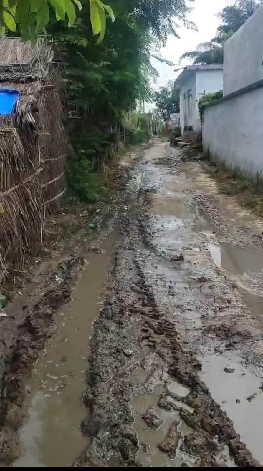Due to lack of road and drain construction, water filled on the road, disrupting the movement of villagers.