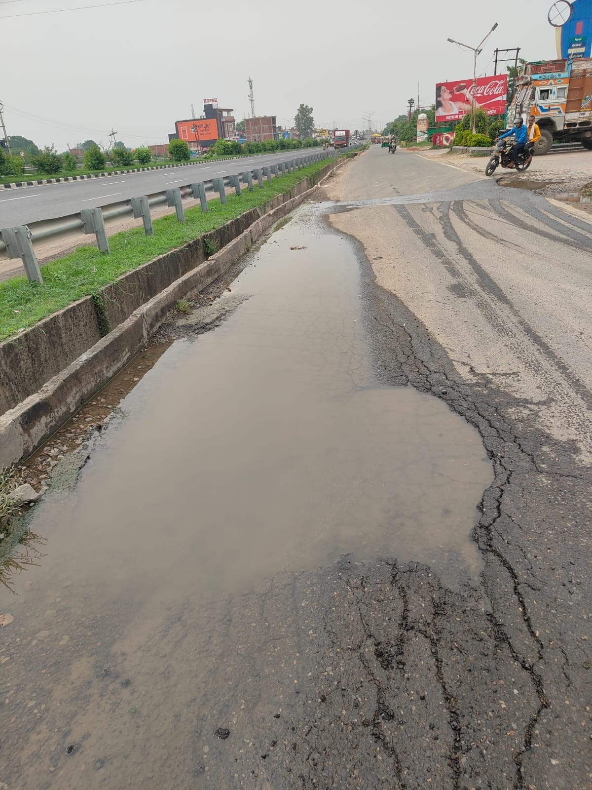 Potholes on the service road are inviting trouble