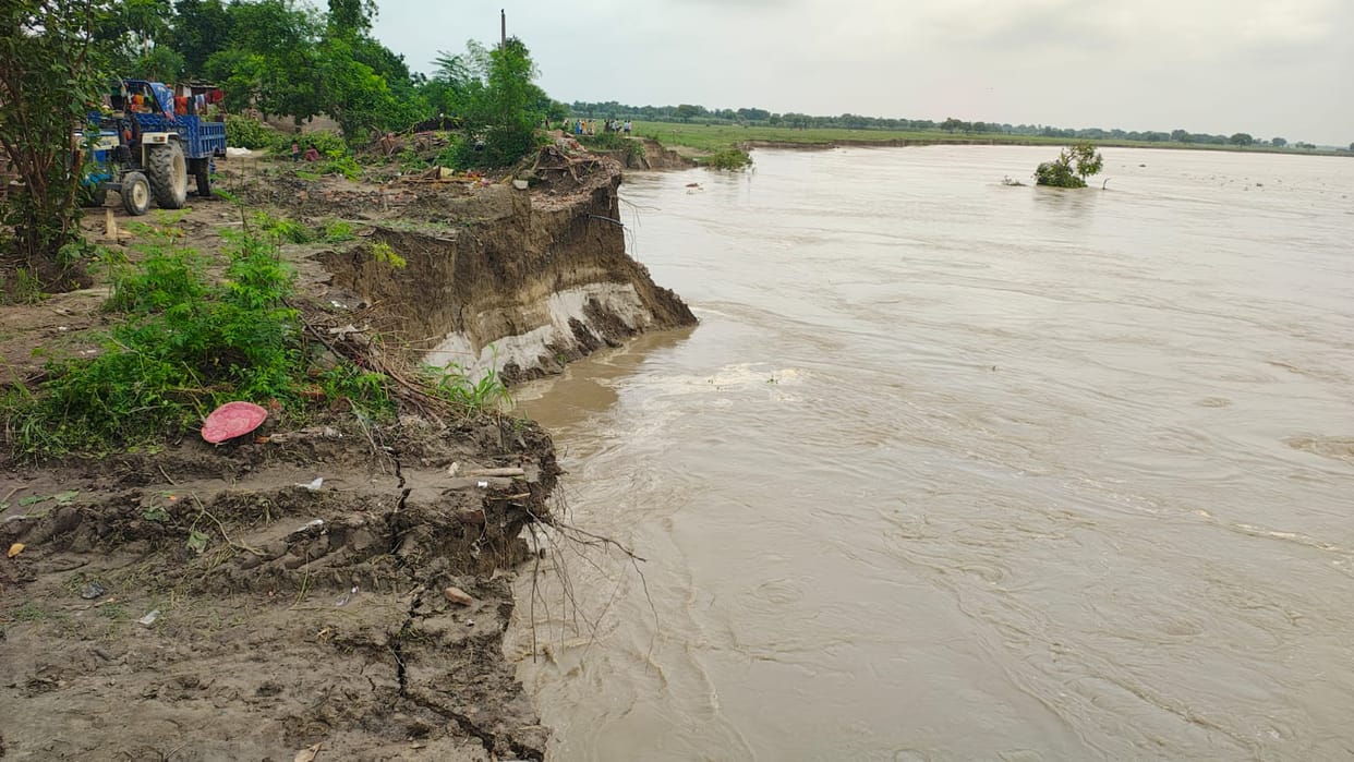Two houses submerged in the Saryu River at Gopal Nagar Tadi.