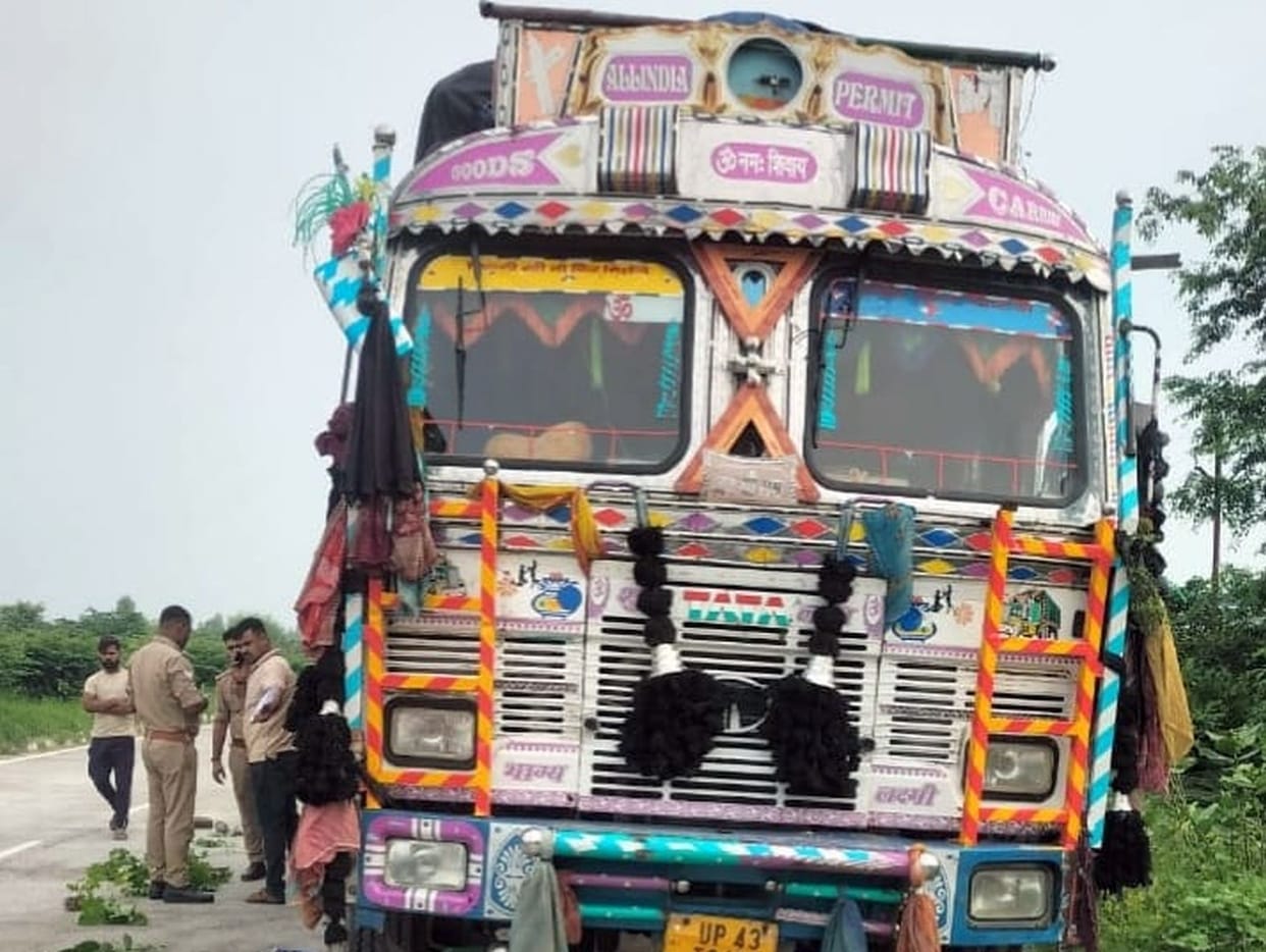Out-of-control vehicle runs over truck driver on highway.