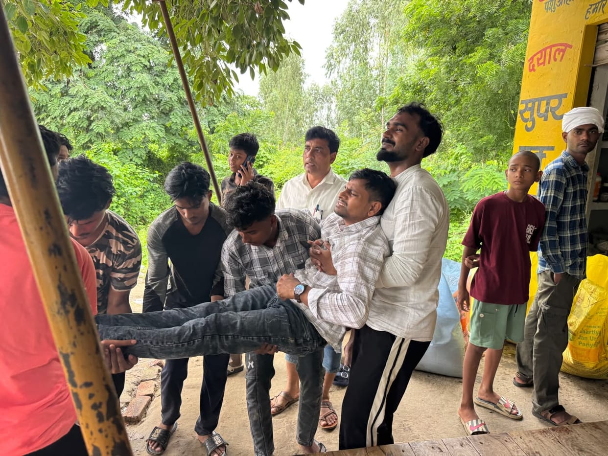 School bus hits biker, three injured
