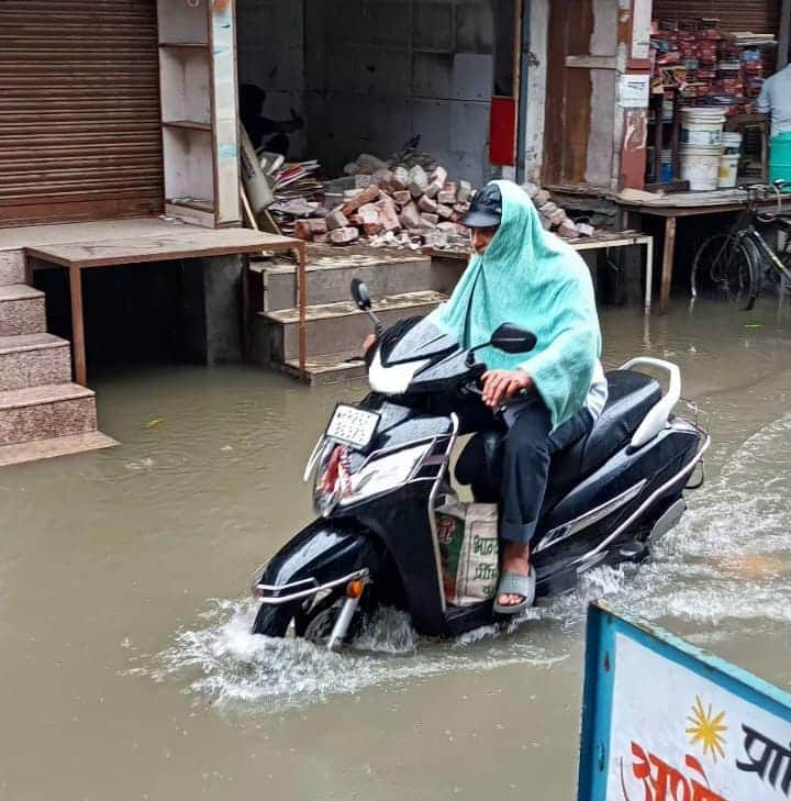 The temperature dropped by five degrees due to the rain.