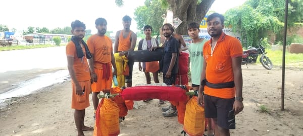 Shiva devotees walking on foot carrying Kanwar