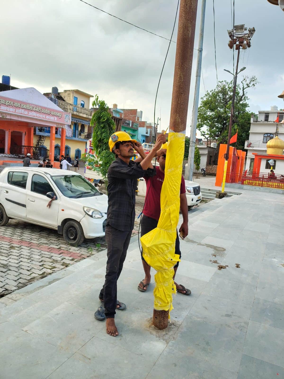Electric poles fitted with plastic covers
