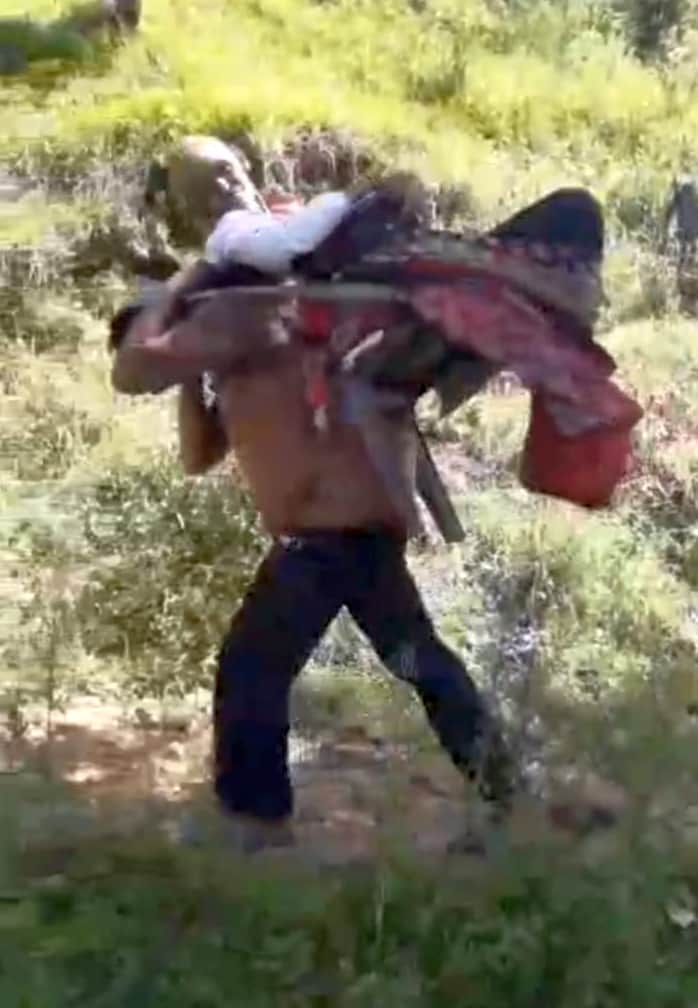 Villagers forced to carry a sick elderly man on a chair and walk four kilometers