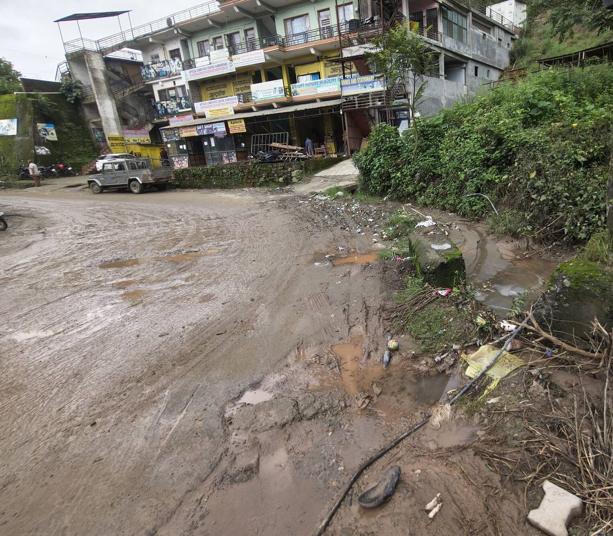 Blocked culvert in Ramshahar; debris strewn across the road.