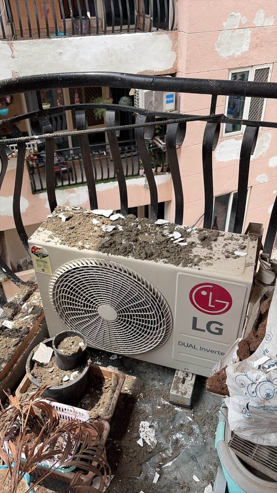 Plaster falls from balcony again; families in six towers live in fear.