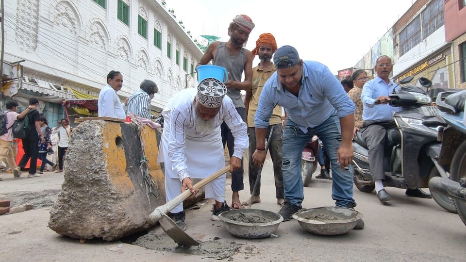 A former councilor filled seven potholes on the road from Nai Sadak to Benia Bagh.